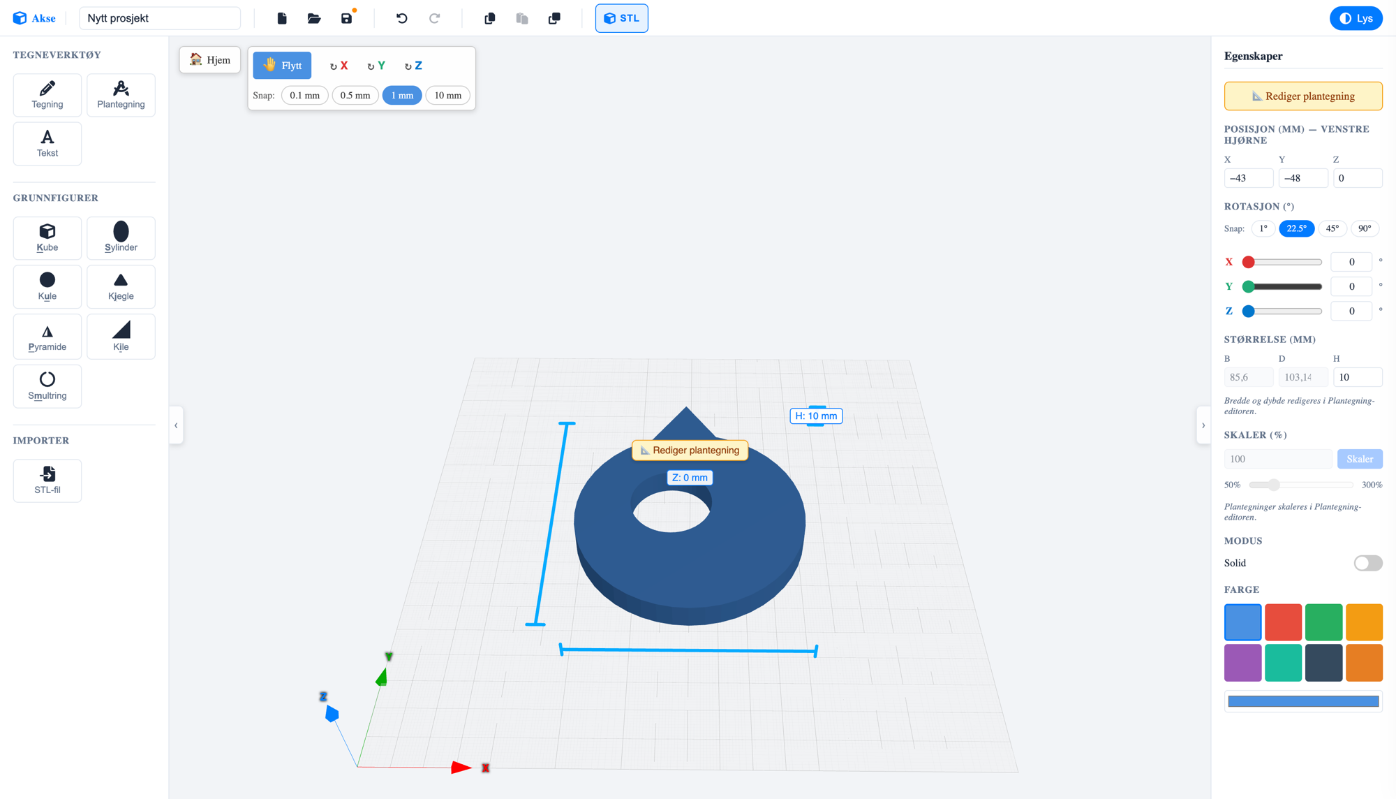 The Akse editor: a blue torus-shaped 3D model with a hole, surrounded by the shape library on the left and the properties panel on the right